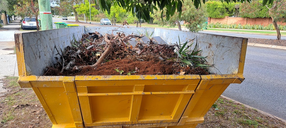 Green waste loaded and ready for disposal at a PGR clearance job