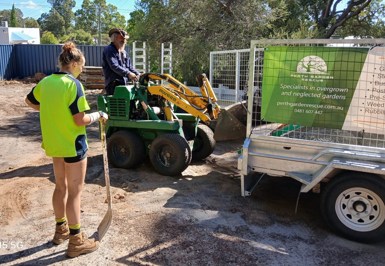 PGR Dingo mini-loader squeezing through a side gate