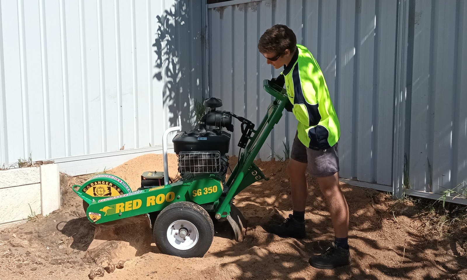PGR stump grinder removing a tree stump below grade