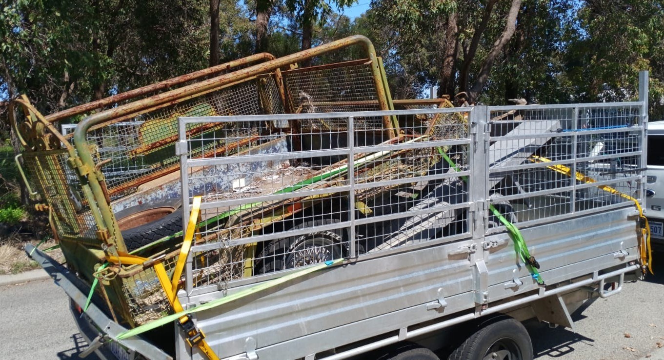 PGR trailer loaded with green waste and hard rubbish, ready to leave site